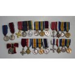 Five groups of First World War period and later dress miniature awards, including a Military Cross