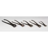 A group of five 19th century steel scissor-action bullet moulds.Buyer’s Premium 29.4% (including VAT