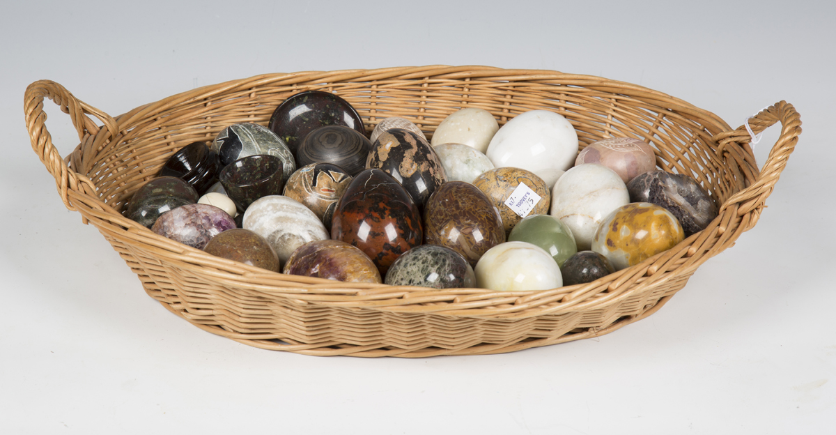 A collection of 20th century egg and other formed polished stone mineral specimens.Buyer’s Premium