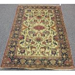 A Turkish rug, early/mid-20th century, the ivory field with overall palmettes and flowerheads,