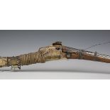 A late 19th century Middle Eastern matchlock rifle with cast and shaped barrel, barrel length 112cm,