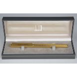 A modern Dunhill gold plated fountain pen, boxed.Buyer’s Premium 29.4% (including VAT @ 20%) of