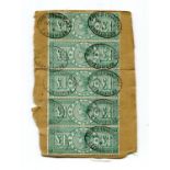 A Great Britain vertical strip of five £1 green tied to piece with oval 1898 registered Leadenhall