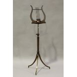 An Edwardian Neoclassical Revival mahogany music stand with foliate inlaid decoration, the lyre