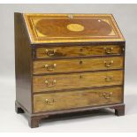 A George III mahogany bureau, the fall flap inlaid in satinwood and tulipwood with shell and rosette