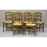 A set of six 20th century French ash framed kitchen chairs with ladder backs and rush seats,