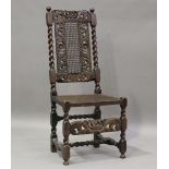 A Charles II style walnut side chair with pierced crown top rail above a caned seat and back, height