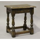 A 20th century Carolean Revival oak joint stool with carved frieze, height 45cm, width 42cm, depth