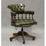 A late 20th century reproduction green leather revolving desk chair, height 88cm, width 62cm.Buyer’s