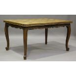 A 20th century French oak draw-leaf dining table with shaped parquetry top, height 74cm, extended
