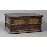 A 17th century oak table-top box, probably English, the hinged lid above floral marquetry panels and