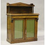 An early Victorian rosewood chiffonier with arched frieze shelf back above a frieze drawer and two