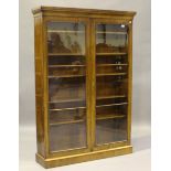 A Victorian mahogany glazed bookcase, fitted with five adjustable shelves, height 187cm, width