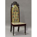 A late Victorian rosewood prie-Dieu chair, the upholstered seat and back raised on turned legs,