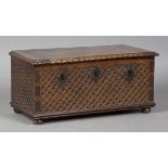 A small 17th/18th century Continental walnut box, the hinged lid with lunette carved edge, the front