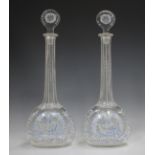 A pair of enamelled glass decanters and stoppers, 19th century, in Beilby style, each flattened