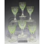 A set of six cut glass wines, early to mid-20th century, each lime green rounded bowl with facet