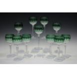 A set of sixteen Waterford Crystal Clarendon emerald hock glasses, together with a pair of ruby