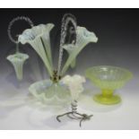 A green and vaseline glass epergne with wavy rims, late 19th century, with three trumpets and
