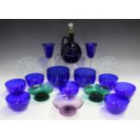 A small group of coloured glassware, late 19th century and later, including a Bristol blue ewer,