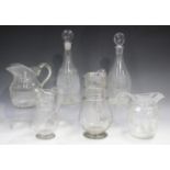 A small group of early 19th century and later glassware, including two cut glass jugs, one with a