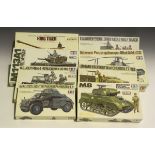 A collection of Tamiya military model kits, including German King Tiger, US Jeep, M-2 Bradley and