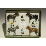 Four repainted Britains Racing Colours of Famous Owners racehorses and jockeys, comprising H.H.