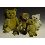 A modern Steiff mohair musical teddy bear with gilt button, amber and black eyes, stitched snout and