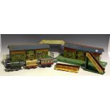 A collection of Hornby gauge O railway items, including two stations, a goods island platform, a