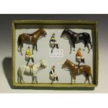 Four repainted Britains Racing Colours of Famous Owners racehorses and jockeys, comprising Miss D.