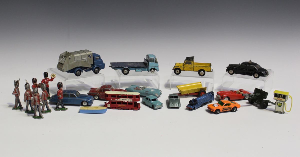 A collection of diecast vehicles and figures, including Corgi Toys, Matchbox 1-75 and Models of