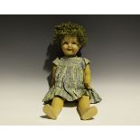 A German composition Shirley Temple doll, impressed 'CB 55', with curly wig, sleeping blue eyes