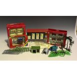 A collection of Britains plastic farm animals and accessories, including a farm playbase, fences,