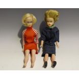 A Palitoy Tressy doll with blonde hair and painted features, wearing a check patterned jacket and