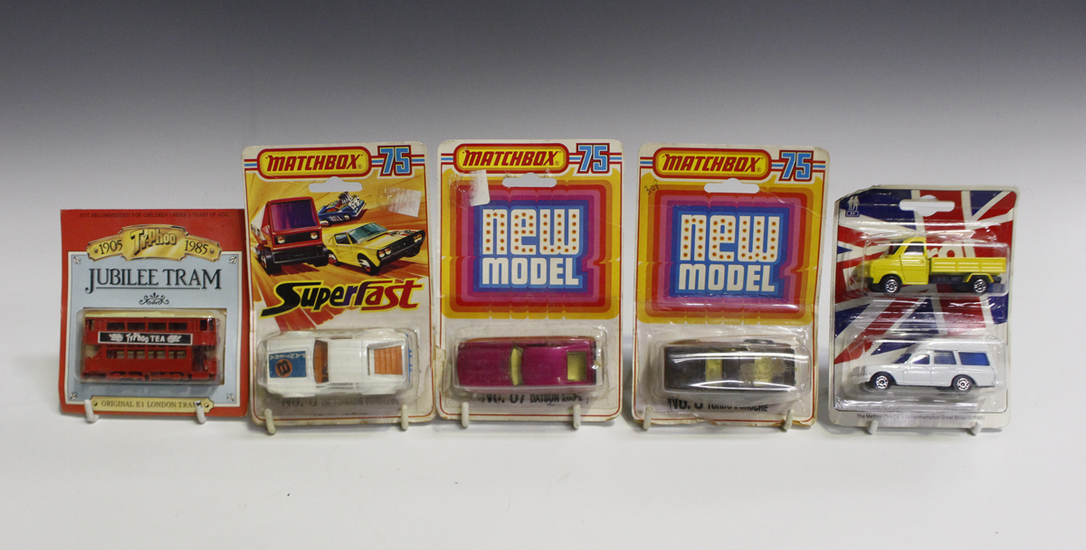 A collection of diecast vehicles, including a Dinky Toys No. 123 Princess 2200HL saloon, a Dinky