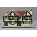 A Tri-ang No. 93 doll's house of Stockbroker Tudor design, on a plinth base, height 64cm, width