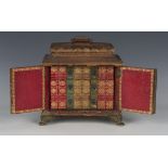 A late George III red gilt-tooled leather table-top writing cabinet, the pagoda top with hinged