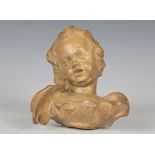 A carved limewood cherub's head, finely modelled with wings, length 16cm.Buyer’s Premium 29.4% (