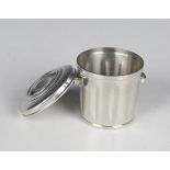 A Cartier pewter 'trashcan' ashtray, formed as a twin-handled lidded dustbin, detailed 'Cartier