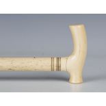 A mid-Victorian whalebone and ivory scrimshaw walking cane, length 82cm.Buyer’s Premium 29.4% (