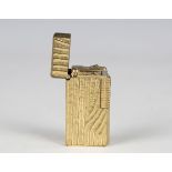 A Dunhill 70 gilt metal pocket lighter, length 5.9cm, cased.Buyer’s Premium 29.4% (including VAT @