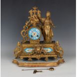 A mid to late 19th century French gilt spelter and porcelain mantel clock with eight day movement