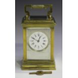 An early 20th century French brass cased carriage clock with eight day movement striking hours and