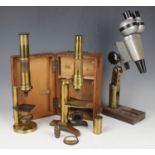 An early 20th century lacquered brass monocular microscope, boxed, together with another brass