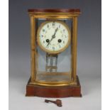 An early 20th century French gilt brass and mahogany four glass mantel clock with eight day movement