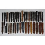 A collection of twenty-four Omega black and brown leather wristwatch straps, some with Omega