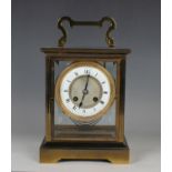 A 20th century gilt lacquered brass four glass mantel clock, the eight day movement with platform