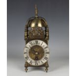 A 20th century brass lantern style mantel timepiece of typical form, the dial inscribed 'An