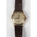 An Omega Genève 9ct gold circular cased wristwatch, circa 1954, the signed and jewelled 266