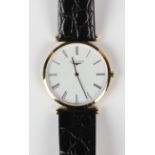 A Longines gilt metal circular cased gentleman's wristwatch with quartz movement, the signed